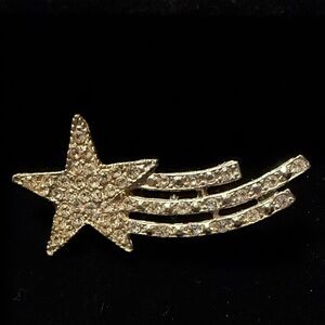 vintage shooting star brooch featuring rhinestones
